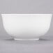 A white 10 Strawberry Street small oval porcelain rice bowl.