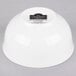 A white 10 Strawberry Street small oval porcelain rice bowl with black text on it.