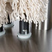 A Bar Maid electric glass polisher with white polishing heads.