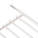 A stainless steel Cooking Performance Group broiler rack with four metal bars.