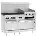 A large stainless steel Wolf commercial gas range with 6 burners, a griddle, and 2 ovens with black knobs.