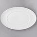 A white porcelain platter with a white rim.