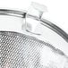 A Vollrath stainless steel mesh strainer with a handle.