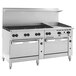 A stainless steel Wolf commercial gas range with 8 burners, a griddle, and 2 convection ovens.