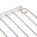 A stainless steel Cooking Performance Group oven rack with four bars.