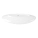 An oval white porcelain plate with a smooth, modern design.
