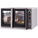 A Blodgett electric commercial convection oven with trays of food inside.
