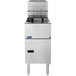 A Pitco Solstice natural gas floor fryer with a lid.