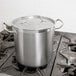 A large silver Vollrath stock pot on a stove.