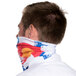 A man wearing a Headsweats Colorado headband with the Colorado flag on it around his neck.