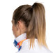 A woman wearing a Headsweats Colorado Ultra Band headband with a ponytail tied in a close-up.