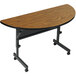 A Correll seminar table with a curved wooden top.