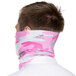 A man wearing a pink and white camouflage headband.
