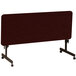 A mahogany rectangular Correll seminar table with wheels.