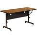 A brown rectangular Correll seminar table with wheels.