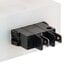 A close-up of a black and white Robot Coupe On/Off switch assembly.