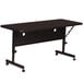 A black rectangular Correll Deluxe Flip Top Table on wheels.