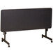 A black rectangular Correll seminar table with wheels.