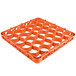 An orange plastic Carlisle OptiClean glass rack extender with compartments and holes.