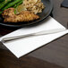 A plate of food with a 10 Strawberry Street Lincoln stainless steel dinner knife and fork on it.