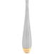 A close up of a 10 Strawberry Street stainless steel salad fork with a white and gold pattern.