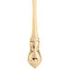 A close up of a 10 Strawberry Street gold plated stainless steel butter knife with a decorative design.