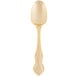 A gold plated stainless steel dinner spoon with a crown design on the handle.