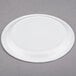 A Solo Symphony white paper plate with a circular rim on a gray surface.