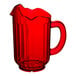 A Vollrath Traex ruby red plastic pitcher with a handle.