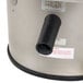 A close-up of a Hobart countertop potato peeler with a stainless steel and black machine.