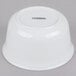 A white Cambro porcelain bowl with black text that reads "Cambro" on the surface.