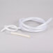 A white plastic tube and a white plastic tube connected to a Hoshizaki condensate drain pump.