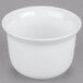 A close-up of a Cambro Classic White Porcelain Ware bowl.