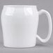 A close up of a white mug with a handle.