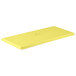 A yellow rectangular MFG Tray with a white logo.