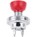 A close-up of a red and silver KitchenAid whisk attachment with a red button.