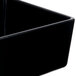 A black square Tablecraft melamine bowl.