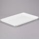 A white MFG Tray Supreme Display Tray on a gray surface.