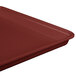 A close-up of a burgundy MFG Fiberglass Supreme Display Tray.