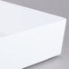 A white rectangular Tablecraft melamine bowl with straight sides.
