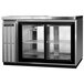 A Continental Refrigerator stainless steel back bar refrigerator with glass doors.