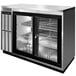 A Continental Refrigerator stainless steel back bar refrigerator with sliding glass doors.