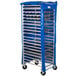 A blue and silver Heavy Duty Bun Pan Rack cover on a rack with wheels.