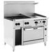 A large stainless steel Vulcan commercial gas range with 4 burners, 24-inch griddle, and 24-inch oven.