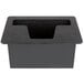 A black rectangular tray with a hole in it on a grey surface.