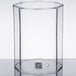 A clear rectangular Cal-Mil acrylic beverage dispenser chamber with a metal ring inside.