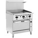 A large stainless steel Vulcan commercial gas range with a manual griddle and black knobs.