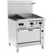 A large stainless steel Vulcan commercial gas range with 2 burners, a 24 inch manual griddle, and a standard oven.