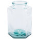 A clear glass container with a blue lid.