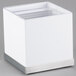 A white cube with clear plastic inside.